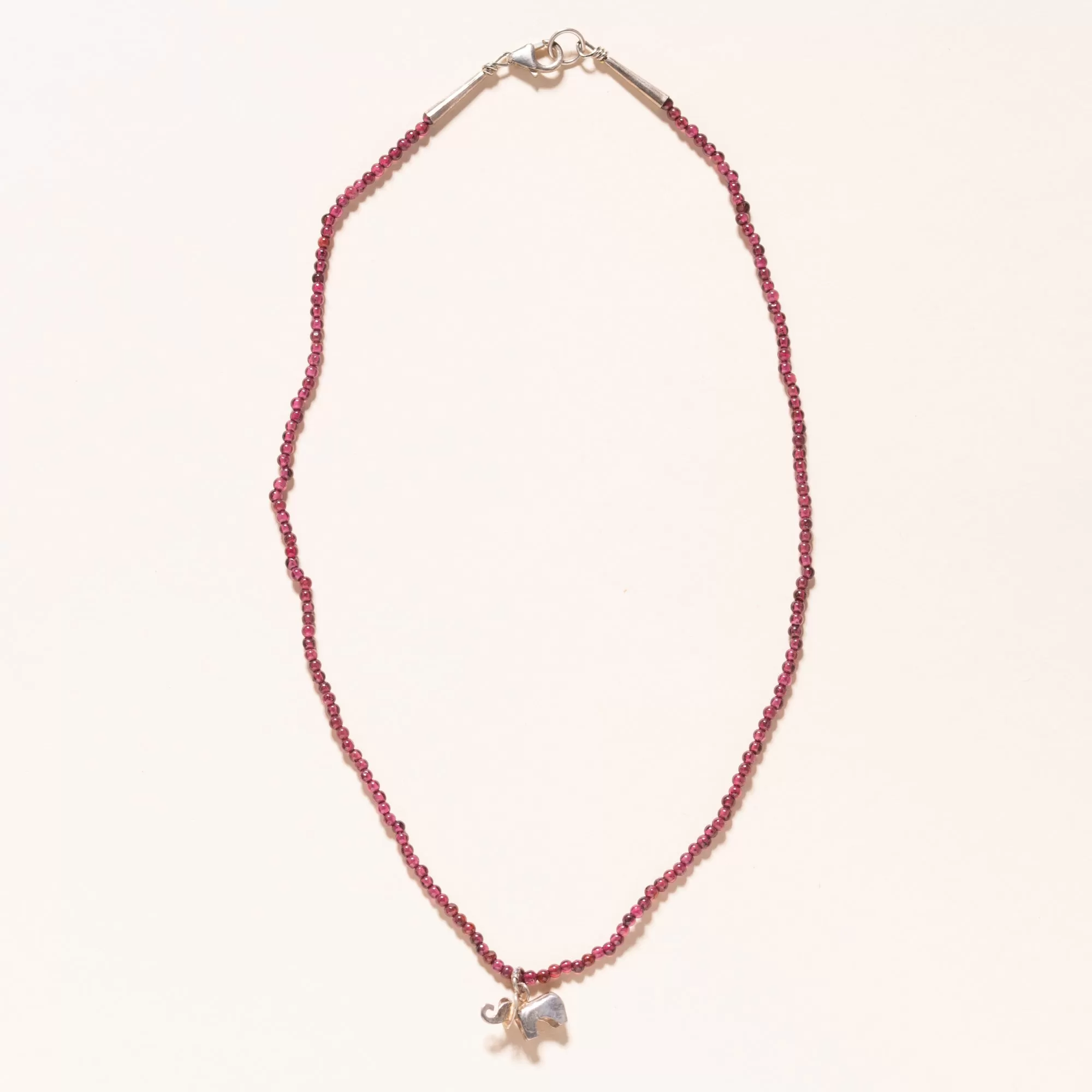 Baby Sterling Silver Isabelle on 2mm Red Garnets. 16”