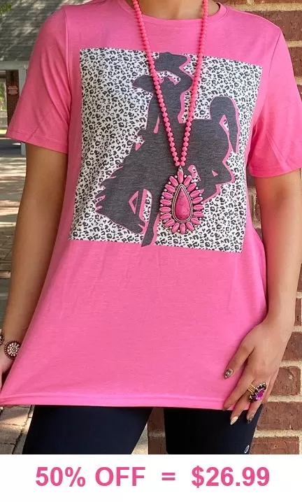 Pink top with bronc rider graphic