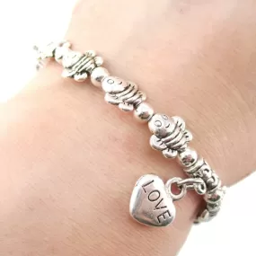 Row Of Bumble Bees Shaped Beaded Stretchy Bracelet in Silver | DOTOLY